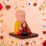 Close-up of red solar Buddha statue showing smooth movement