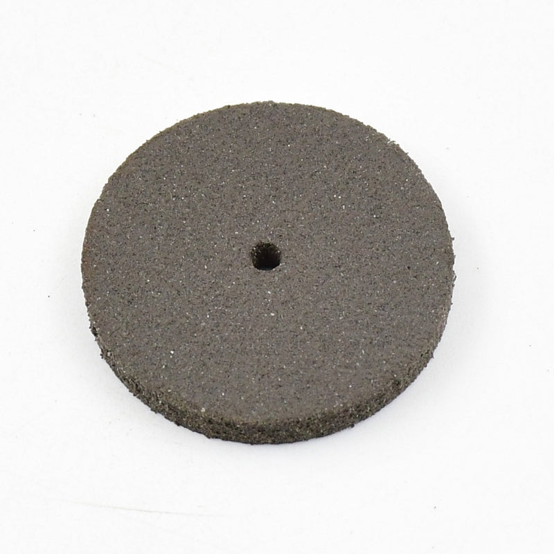 Detailed view of a single durable resin grinder cutting disc for metalwork.