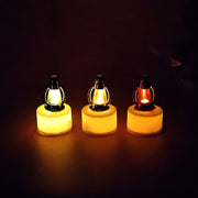 Elegant flameless LED candles with colorful lantern tops displayed in storage box