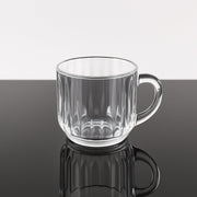 Transparent plastic tea cup filled with hot beverage, lightweight design