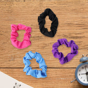 A soft hair scrunchie tied neatly around a hair bun, demonstrating a secure and comfortable hold.