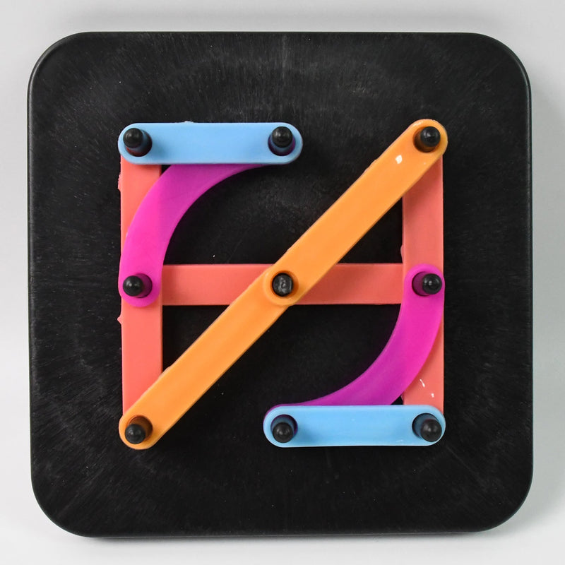 Brightly coloured alphabet numeric puzzle pieces arranged in a grid pattern.