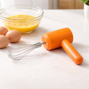 Electric handheld whisk mixer used for beating eggs and mixing batter