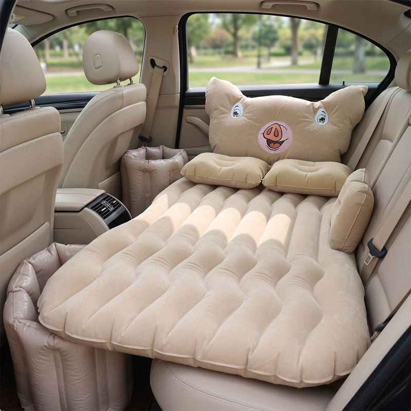 Inflatable car mattress installed in sedan back seat for travel