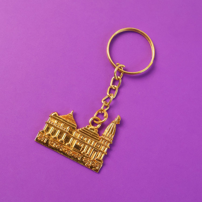Ram Mandir keychain hanging with keys, showcasing metal craftsmanship