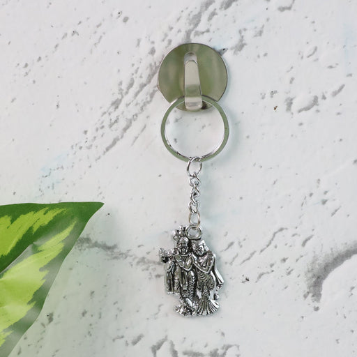 Detailed view of durable metal Radha Krishna keychain with ornate craftsmanship