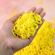 Bright orange elastic rubber bands bundled together