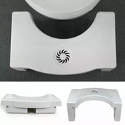 Toilet squat stool in use, highlighting its foldable design and helpful footprint guides.