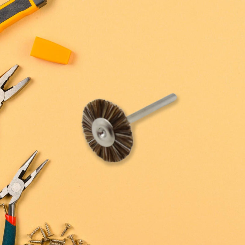 A shank-mounted brass wire brush, ideal as a drill attachment for metal grinding.