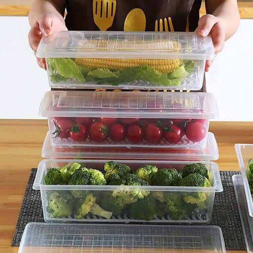 Clear plastic freezer storage container with a removable drain plate, ready for vegetables.