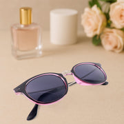 Foldable sunglasses holder mounted on wall with stylish sunglasses
