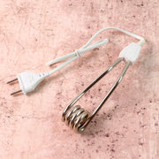Portable immersion heater rod showing its compact design for travel