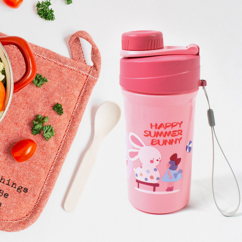 Overhead view of the complete lunch box set, including the reusable food container, bottle, and fork.