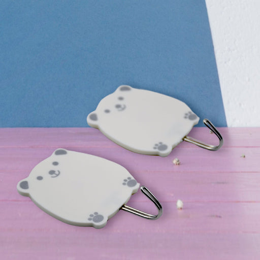 Decorative self-adhesive hook for stylish home organization, shown in a clean setting.