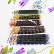 Lit  Pancham incense stick releasing fragrant smoke, creating a calming atmosphere.