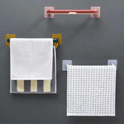 Multifunctional folding towel shelf used in a kitchen for dishcloths and utensils.