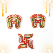 Assorted Laxmi Charan and Swastik decals in bright hues for Diwali décor