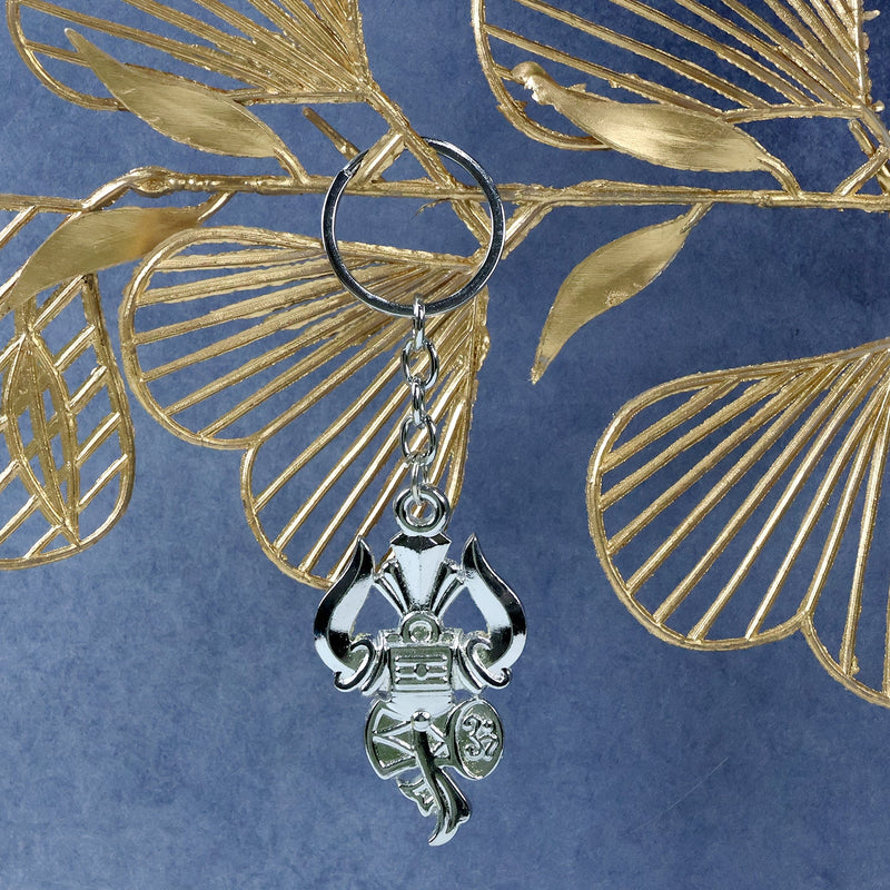 Side angle view of silver Trishul Damru keychain highlighting craftsmanship