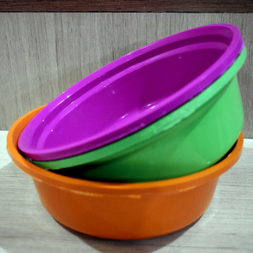Set of three durable round plastic storage bowls for home use.