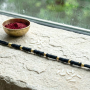 Detailed view of handmade rakhi showcasing intricate bead work