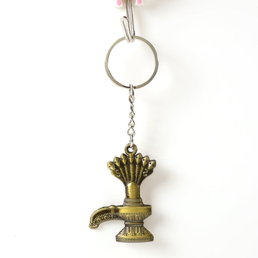 Close-up of Lord Shiva Shivaling metal keychain with detailed serpent design