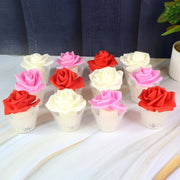 Flameless LED candle with realistic rose flower and glass holder on table