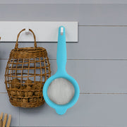 Side view of Kadak mesh strainer with plastic handle