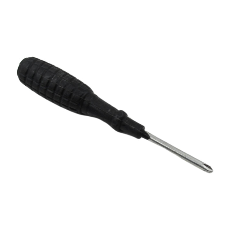 Phillips screwdriver in use, repairing a household appliance.