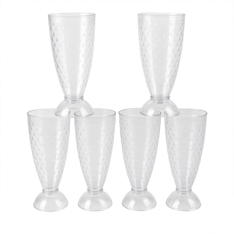Transparent plastic milkshake glasses neatly arranged on a dining table