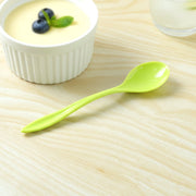 Detail shot of a plastic spoon's smooth handle, designed for comfortable grip.