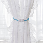 Set of two magnetic curtain tiebacks featuring pearl accents