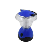The Indo Glow Mini Camping Lantern emitting a powerful white LED light in a dark environment.