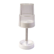 Storage slots of rotating toothbrush holder stand holding toothbrush and toothpaste
