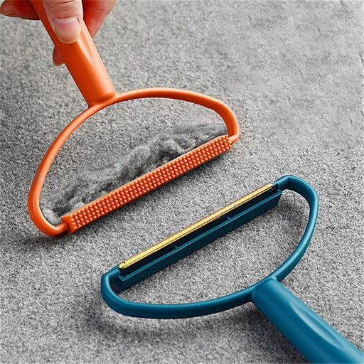 Portable lint remover with long handle, demonstrating its dual fabric brush and copper blade.