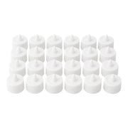 Multiple battery-operated tealights illuminating a dark room.