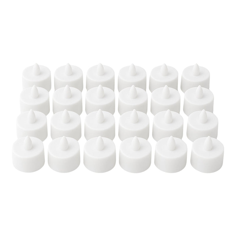 Multiple battery-operated tealights illuminating a dark room.