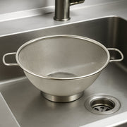 Side profile of stainless steel strainer colander with comfortable handles