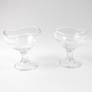 Clear glass dessert bowl highlighting its sturdy footed base.