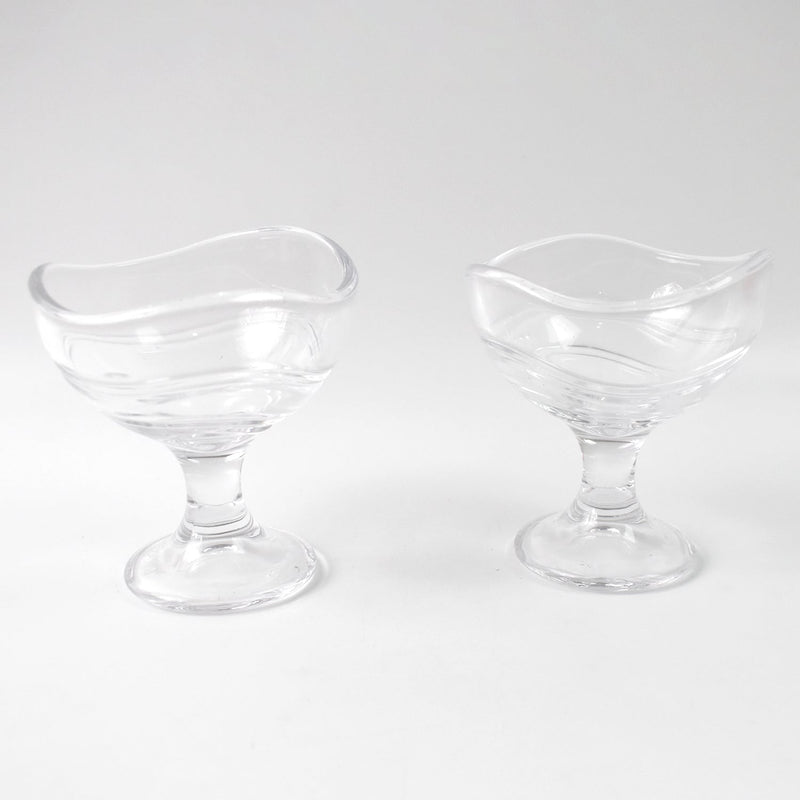 Clear glass dessert bowl highlighting its sturdy footed base.