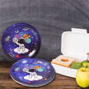 Stack of disposable party plates with 'Happy Cheers' designs, perfect for guests.