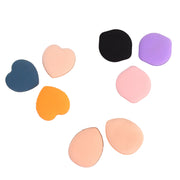Hand holding Mini Finger Makeup Powder Puff applying makeup smoothly