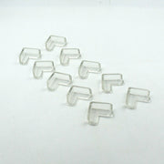 Multiple clear corner guards effectively applied to sharp furniture edges in a home.