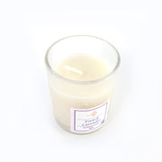 Top view of French Lavender soy candle glowing with warm flame