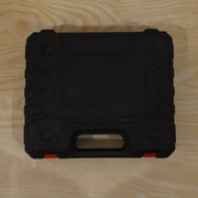 Cordless drill tool kit case on wood surface