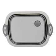 Versatile kitchen tool acting as both a cutting surface and a storage basket.