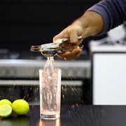 A sleek handheld citrus juicer made from premium stainless steel, ready for use in any kitchen.