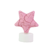 Group of flameless star shaped LED tealight candles shining softly