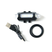 Multipurpose LED bicycle safety light attached easily, demonstrating versatile mounting.