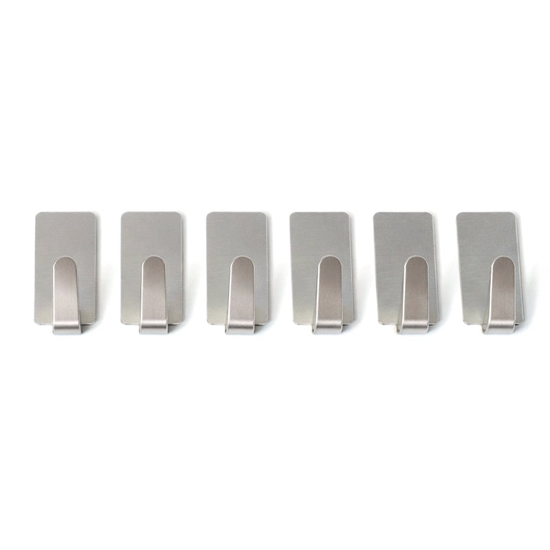 Wall hooks hanging keys and towels in home setting