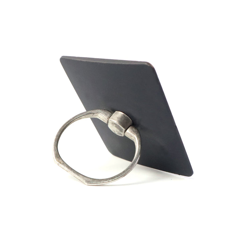 Side profile of the compact phone ring stand, highlighting its slim design.
